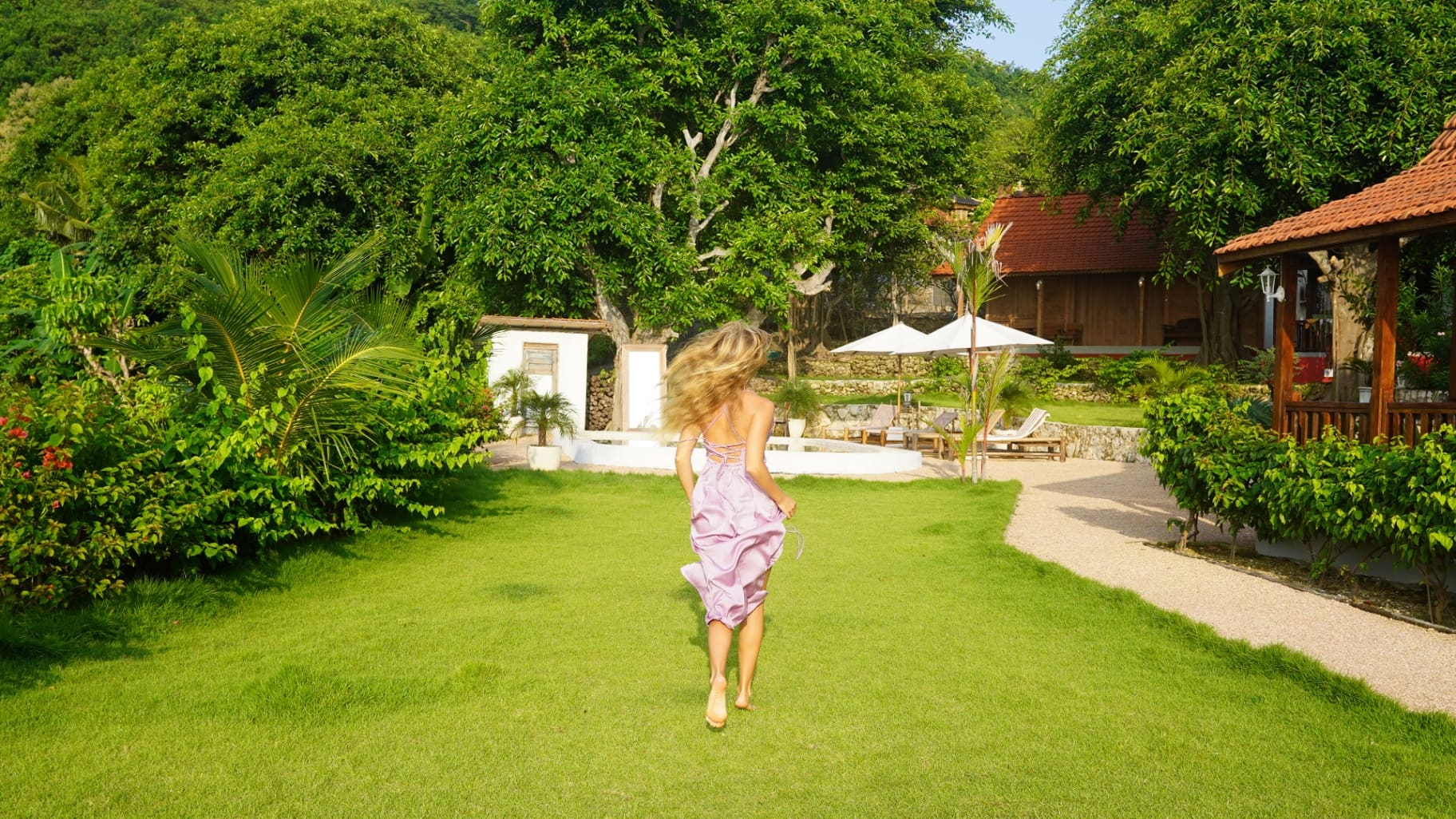 Guest by the pool at a Penida Society villa
